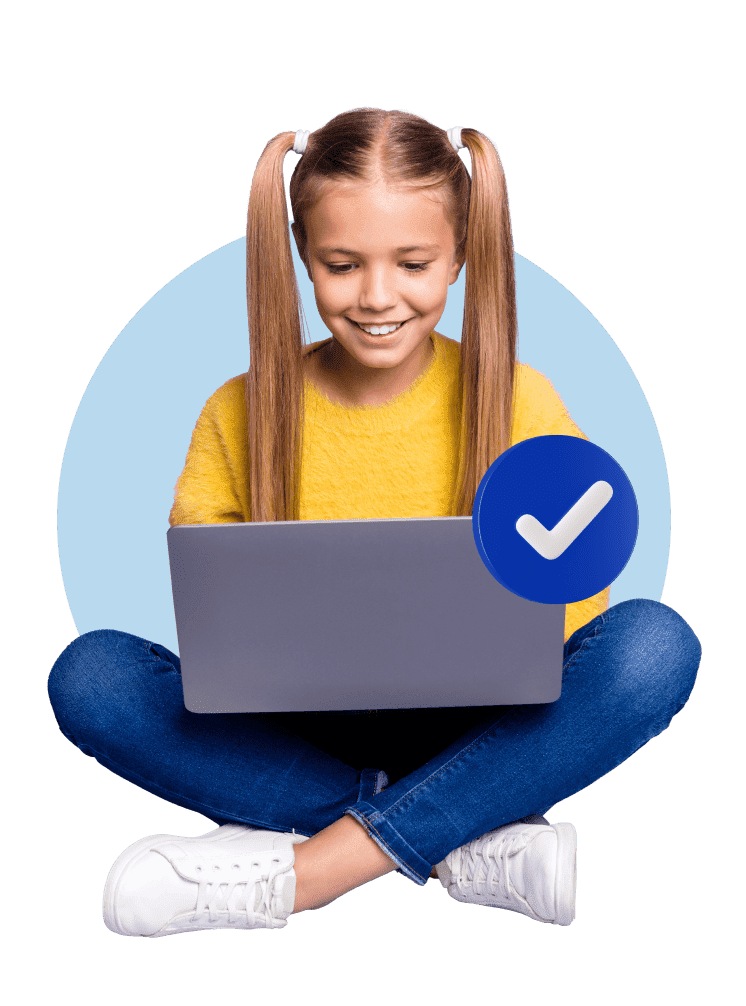 A girl seated on the floor, focused on her laptop, with a prominent check mark displayed nearby.