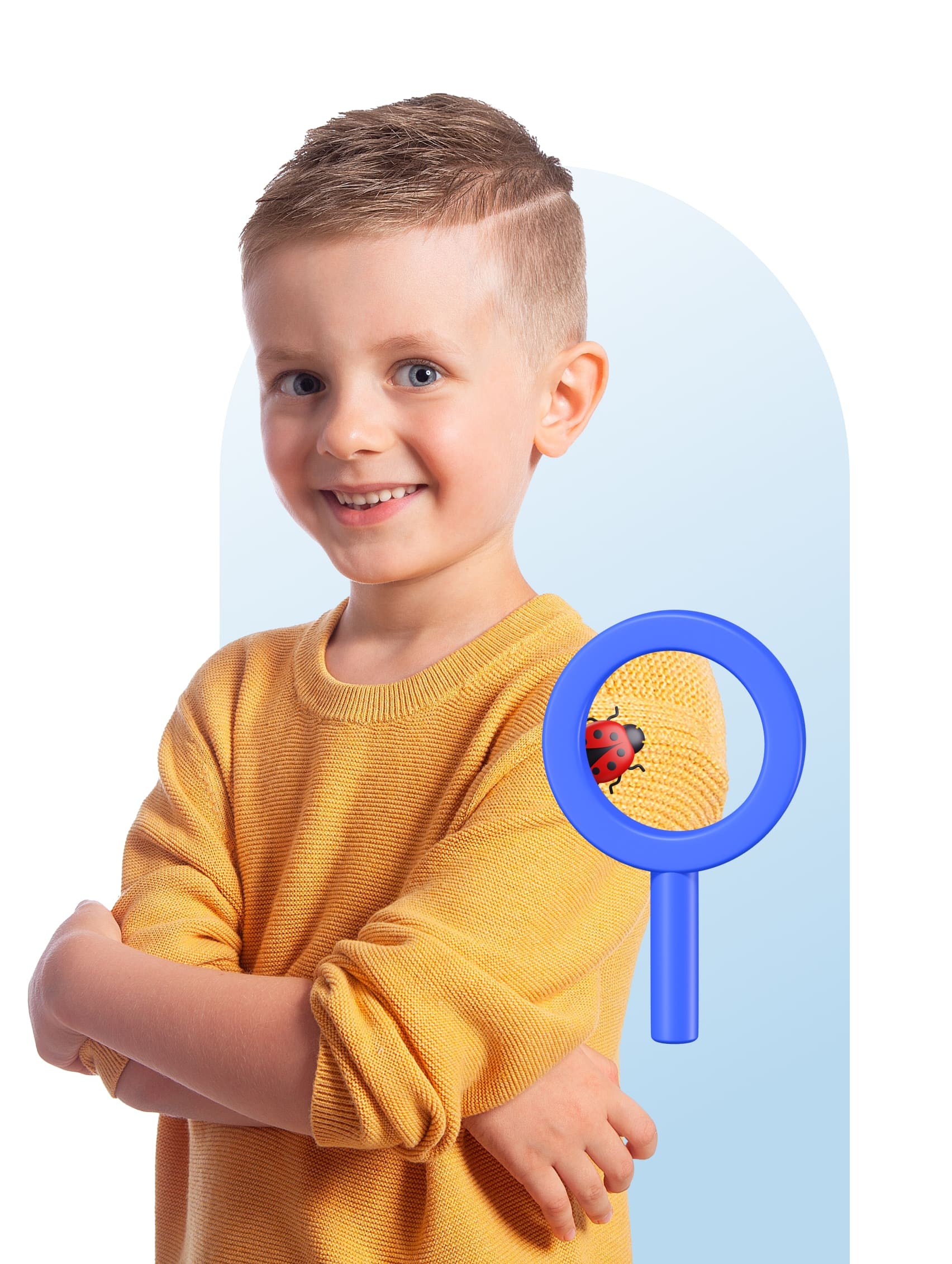 A young boy smiles while holding a magnifying glass, showcasing curiosity and joy in exploration.