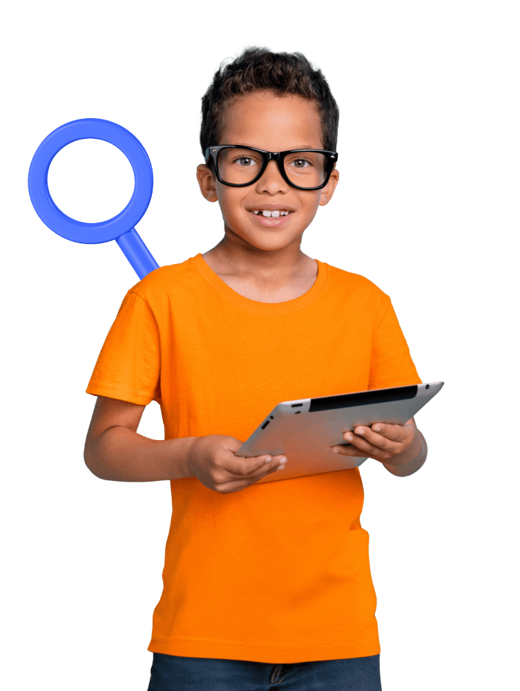 A boy wearing glasses holds a tablet while examining it closely with a magnifying glass.