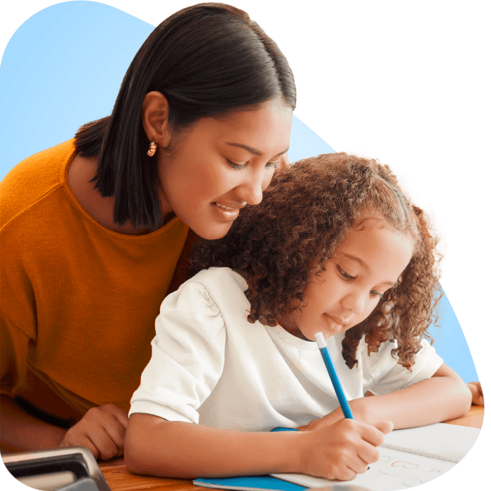 A mother and daughter collaborate on homework at a table, sharing ideas and focusing on their studies together.